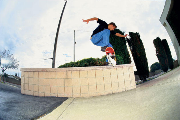 Chad Muska pushes a crooked grind clear across a big ol’ ledge.
